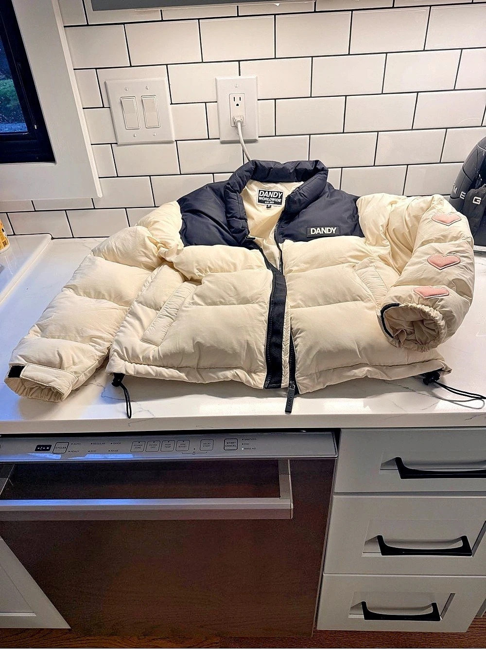 “Heart on my sleeve” Dandy Cream & Black Heart Patch Puffer Like New